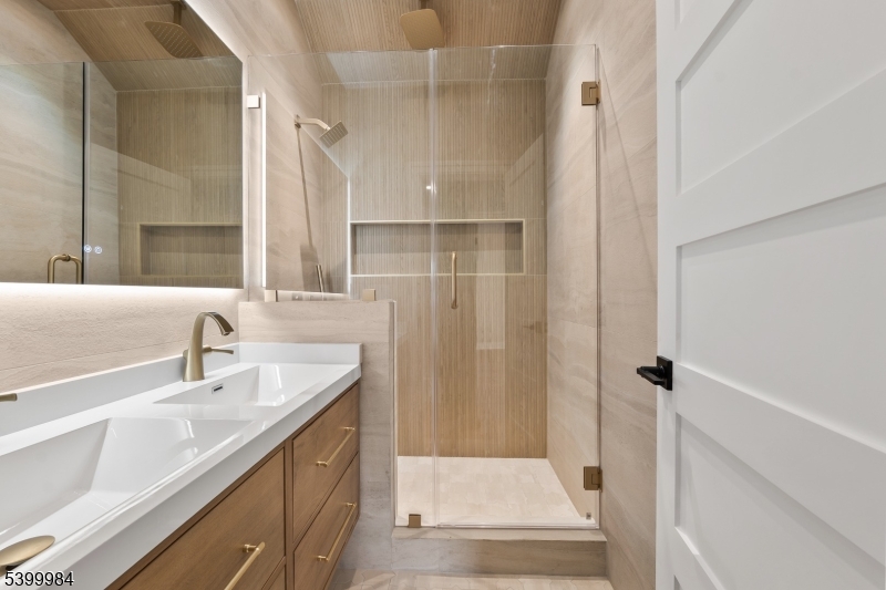 1453 Morris Avenue Union, NJ 07083 - Photo 34 of 48 a bathroom with a sink and a mirror