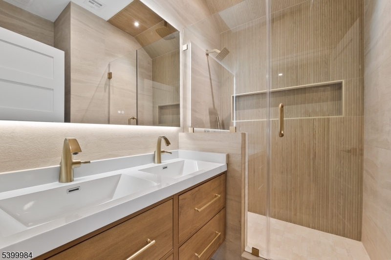 1453 Morris Avenue Union, NJ 07083 - Photo 35 of 48 a bathroom with a sink and a mirror