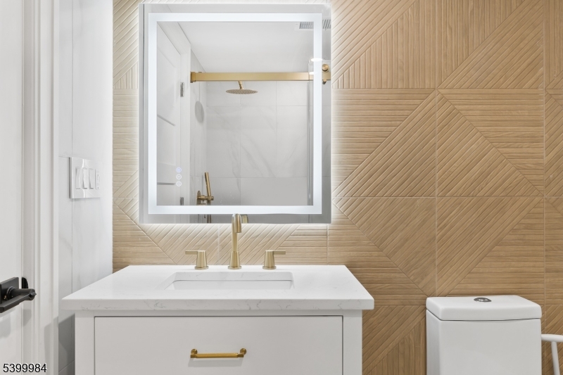 1453 Morris Avenue Union, NJ 07083 - Photo 39 of 48 a bathroom with a sink and a toilet