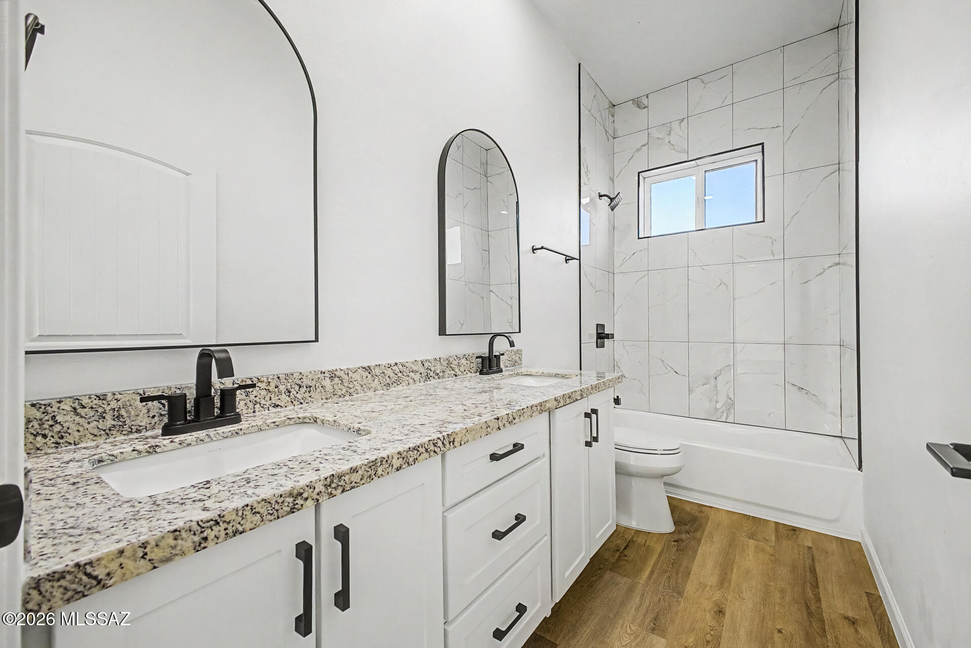 4601 East Magoo Road Tucson, AZ 85739 - Photo 17 of 38 a bathroom with a granite countertop sink toilet and shower