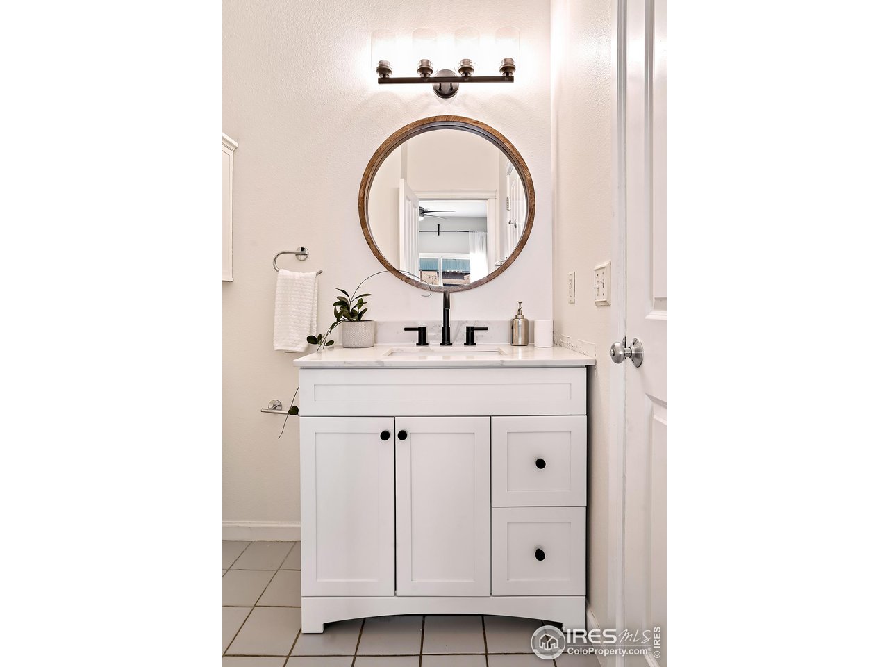 2625 Tabriz Place, Unit 21 Boulder, CO 80304 - Photo 19 of 24 a bathroom with a sink a mirror and a mirror