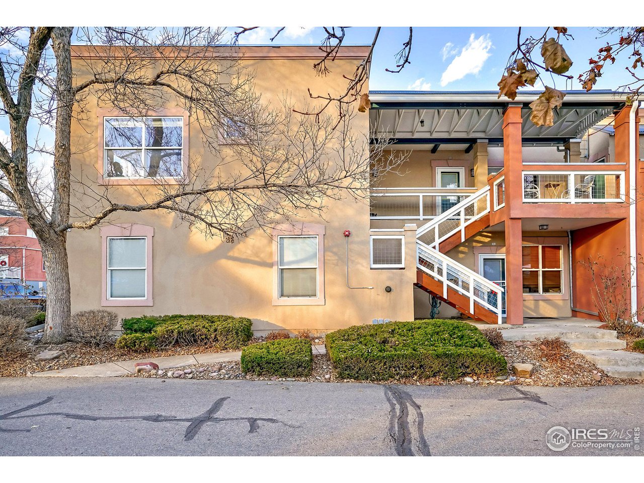 2625 Tabriz Place, Unit 21 Boulder, CO 80304 - Photo 2 of 24 a front view of a house with garden