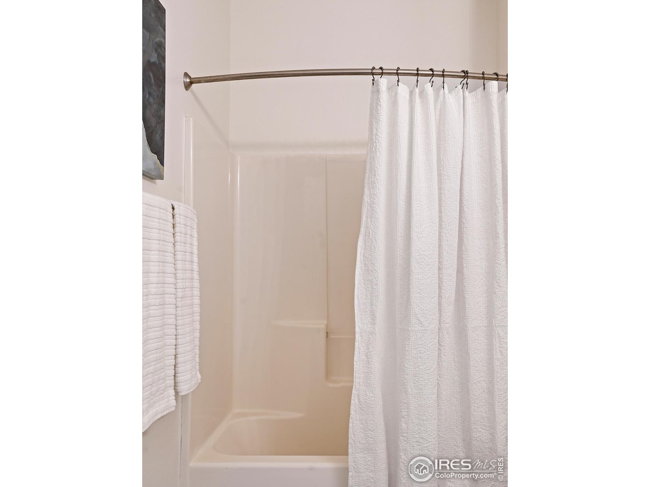 2625 Tabriz Place, Unit 21 Boulder, CO 80304 - Photo 20 of 24 a bathroom with a shower curtain and a window
