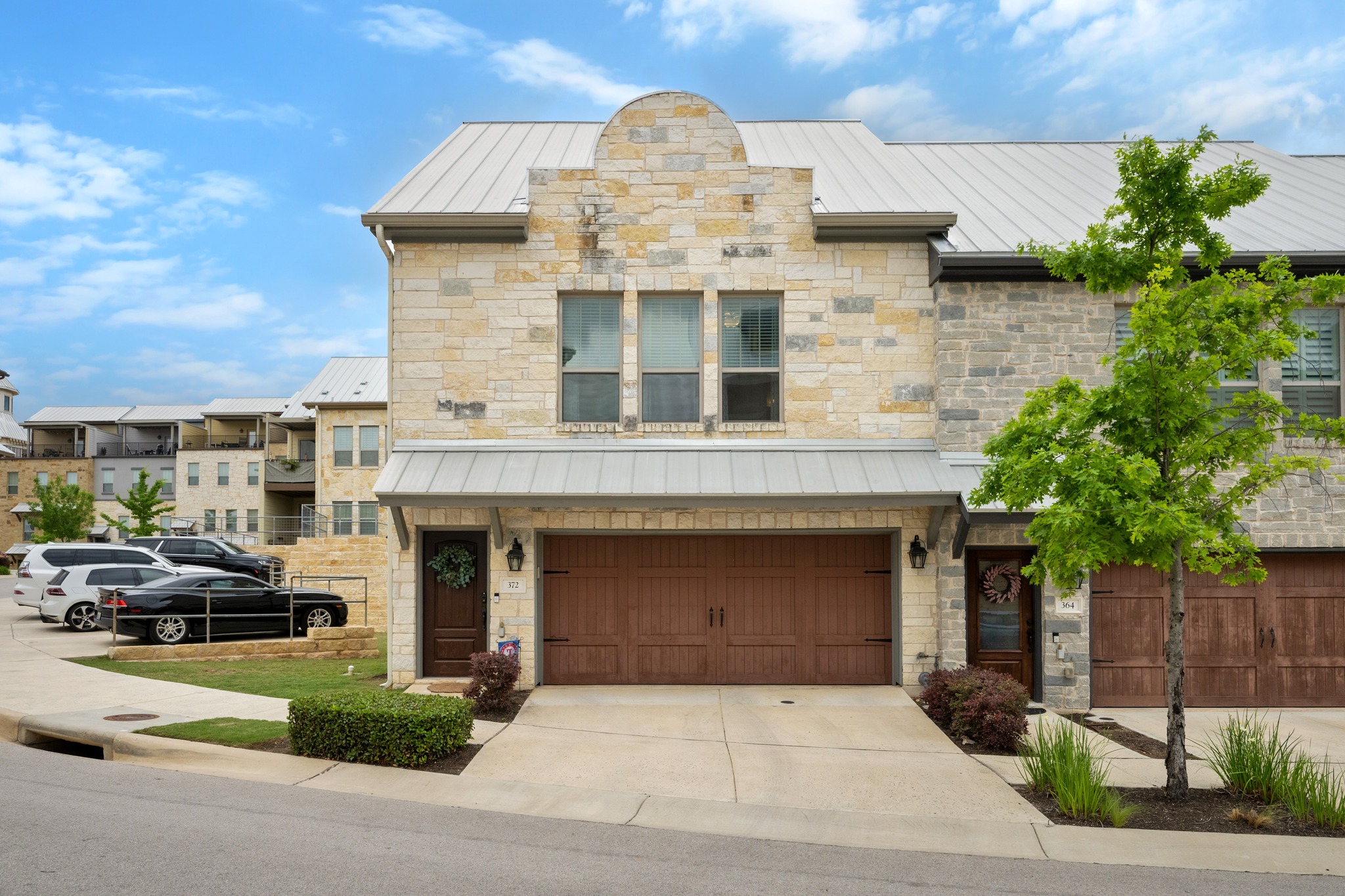 372 Adams Street Georgetown, TX 78628 - Photo 3 of 33 a front view of a house with a garden
