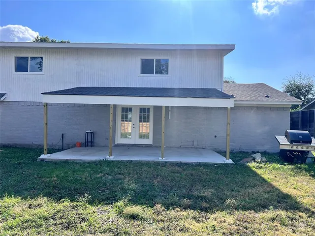 a front view of a house with a yard and porch