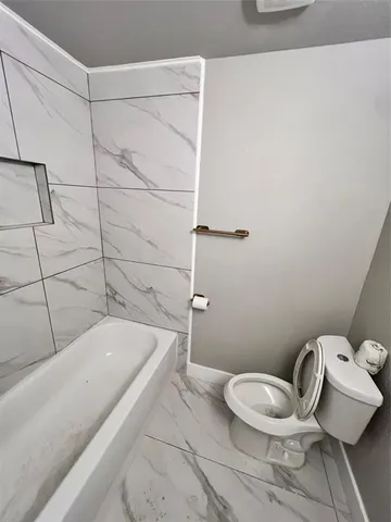 a bathroom with a sink and toilet