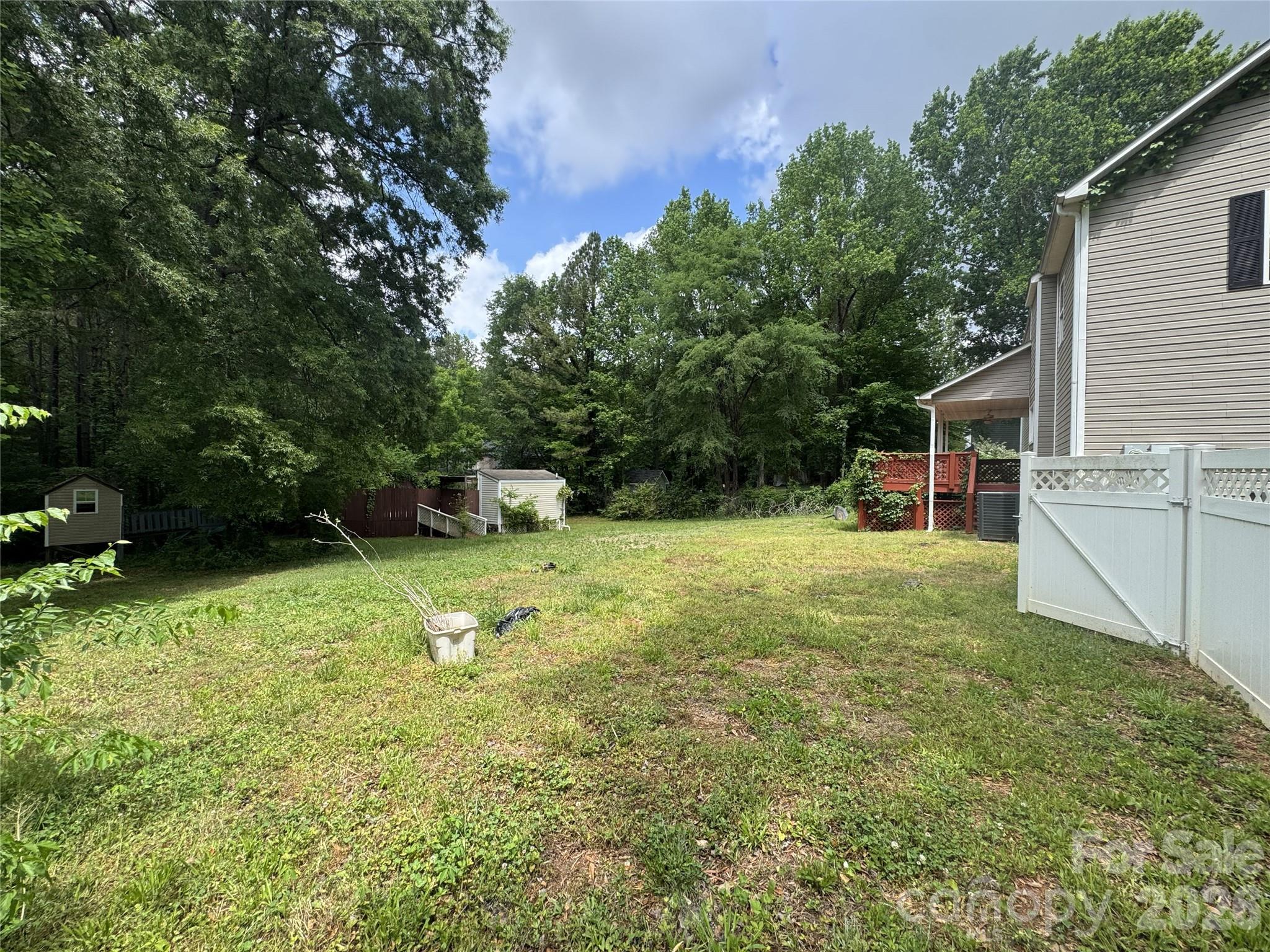 8441 Shelley Mullis Road Fort Mill, SC 29707 - Photo 18 of 23 a backyard of a house with yard and trampoline
