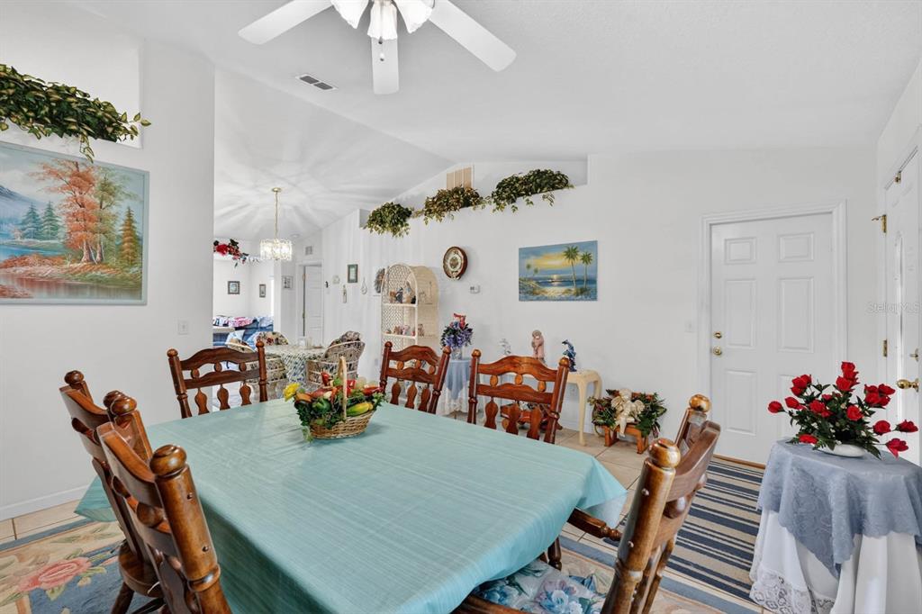 80 Roxboro Drive Palm Coast, FL 32164 - Photo 9 of 39 a view of a dining room with furniture