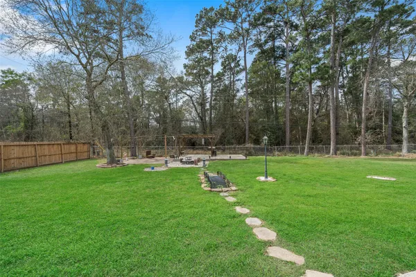 $585,000 | 2438 Ripplewood Drive, Conroe, TX 77384