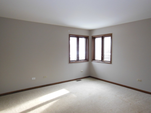5811 Wild Plum Road Crystal Lake, IL 60014 - Photo 6 of 8 an empty room with a window
