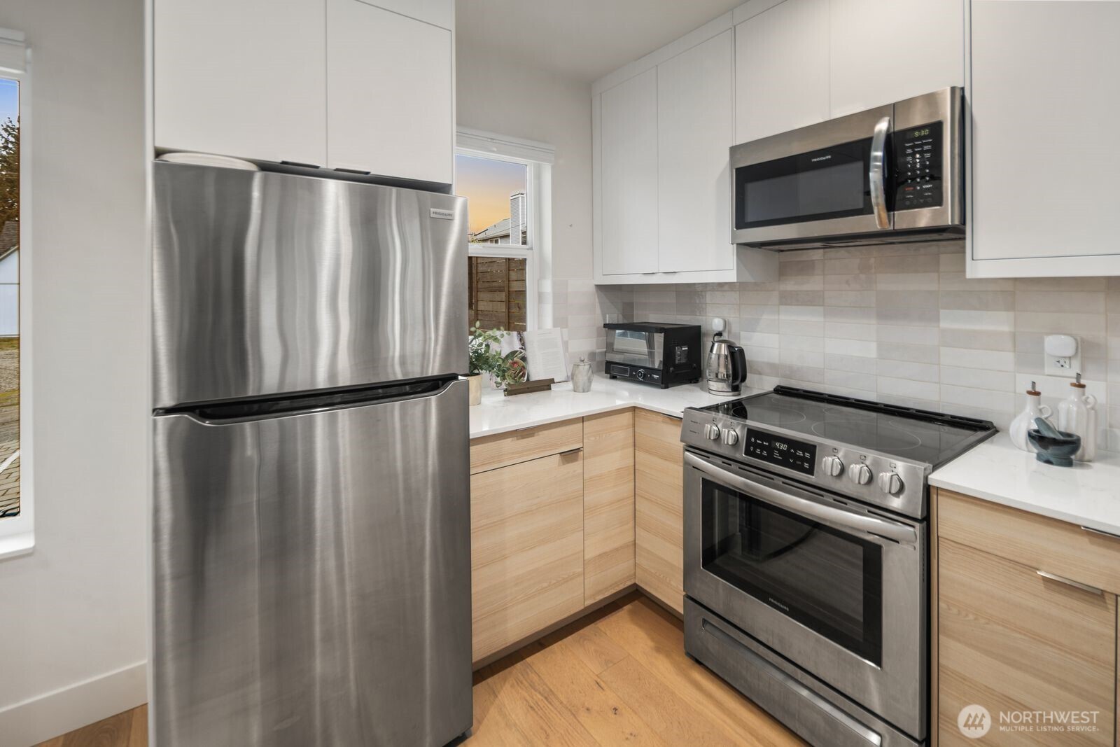 2211 17th Avenue South Seattle, WA 98144 - Photo 12 of 25 a kitchen with a refrigerator stove and microwave
