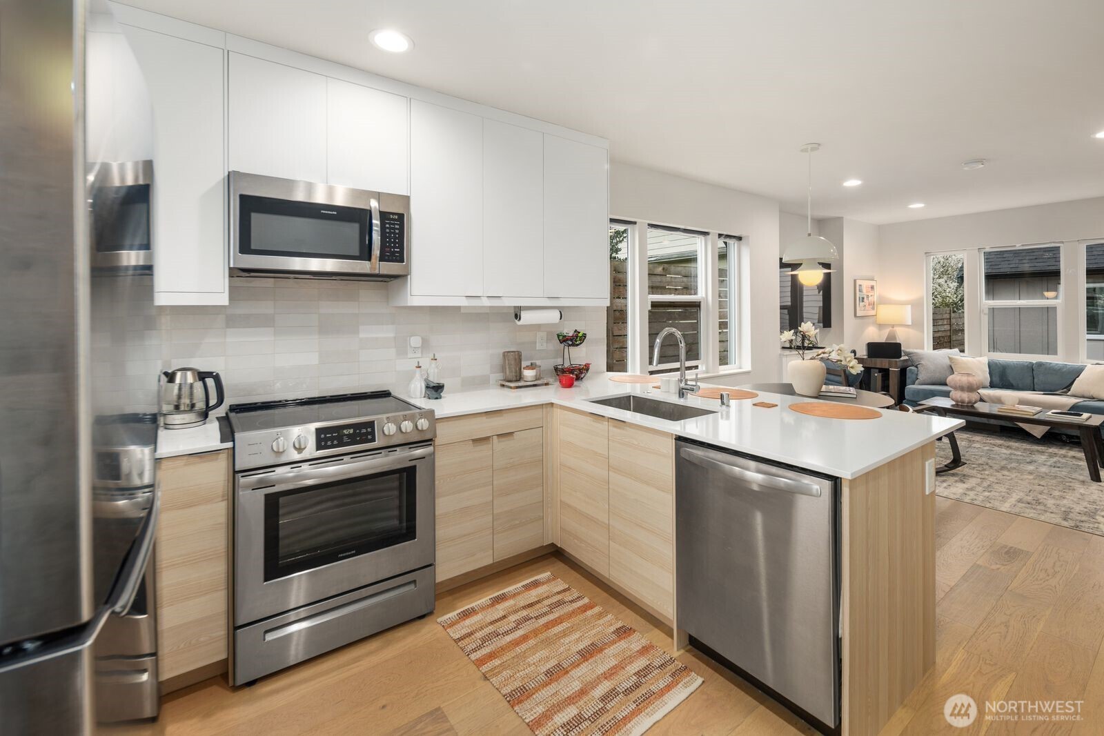 2211 17th Avenue South Seattle, WA 98144 - Photo 13 of 25 a kitchen with a sink stove and microwave