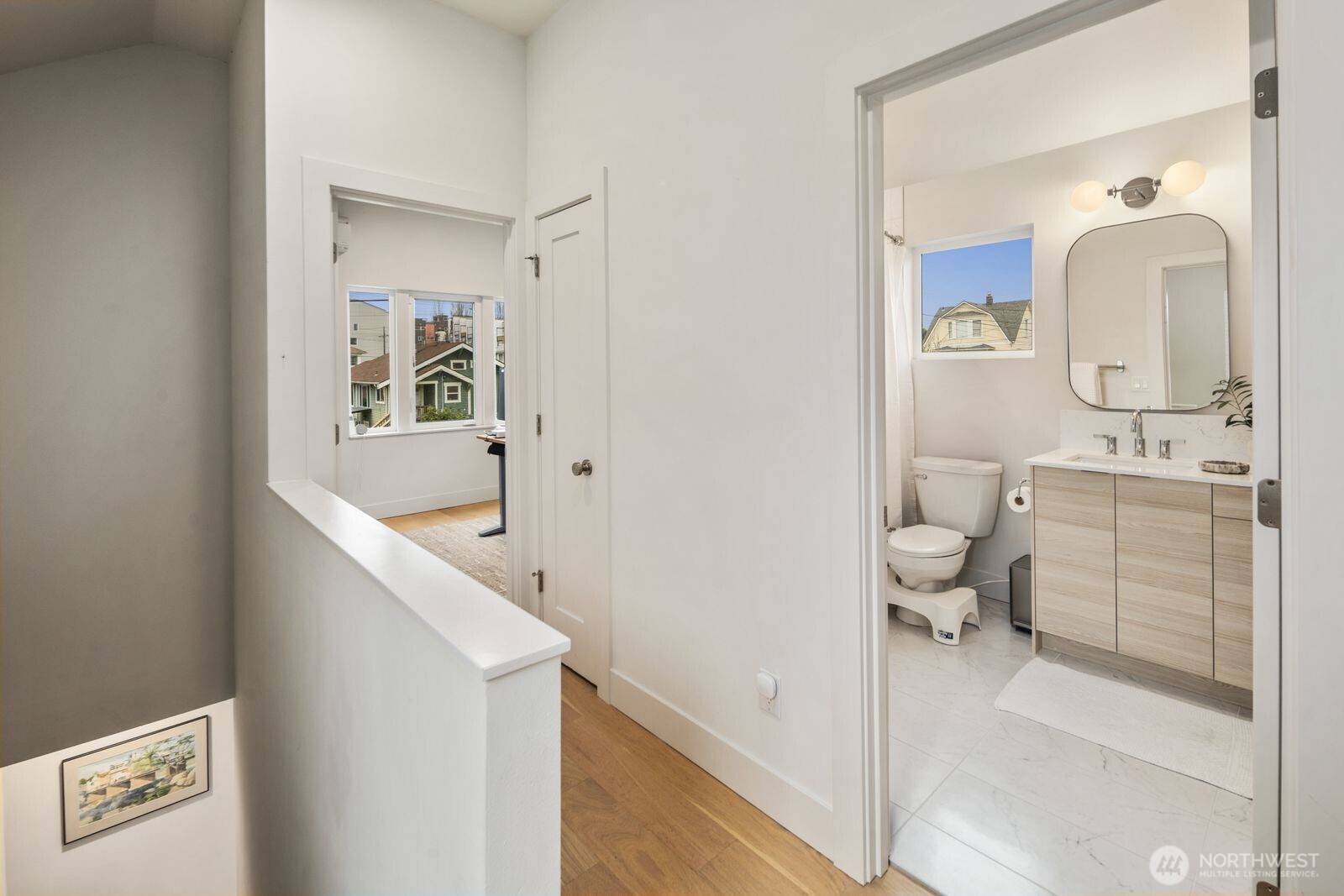2211 17th Avenue South Seattle, WA 98144 - Photo 14 of 25 a bathroom with a sink a toilet and mirror