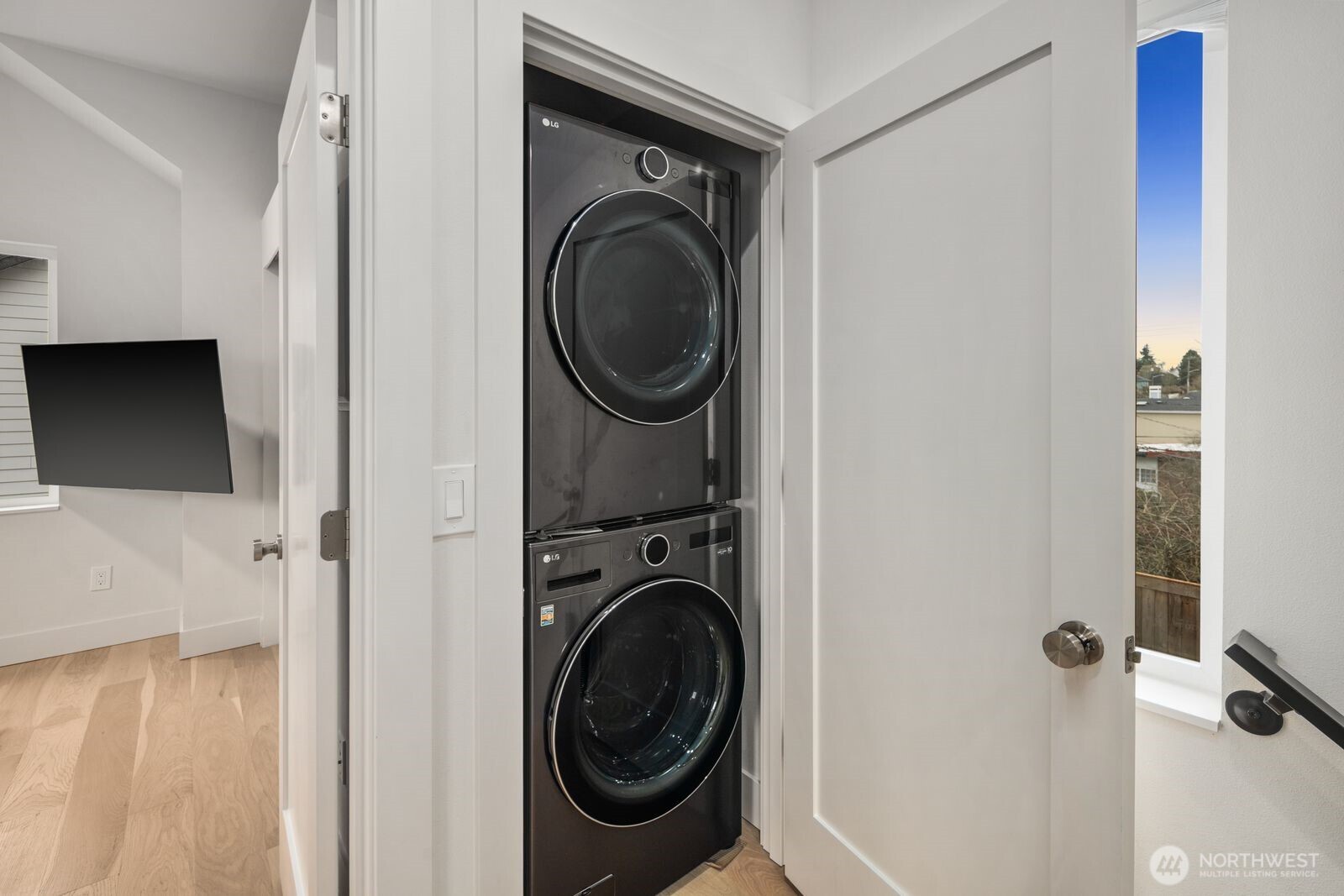2211 17th Avenue South Seattle, WA 98144 - Photo 18 of 25 a view of a hallway with washer and dryer