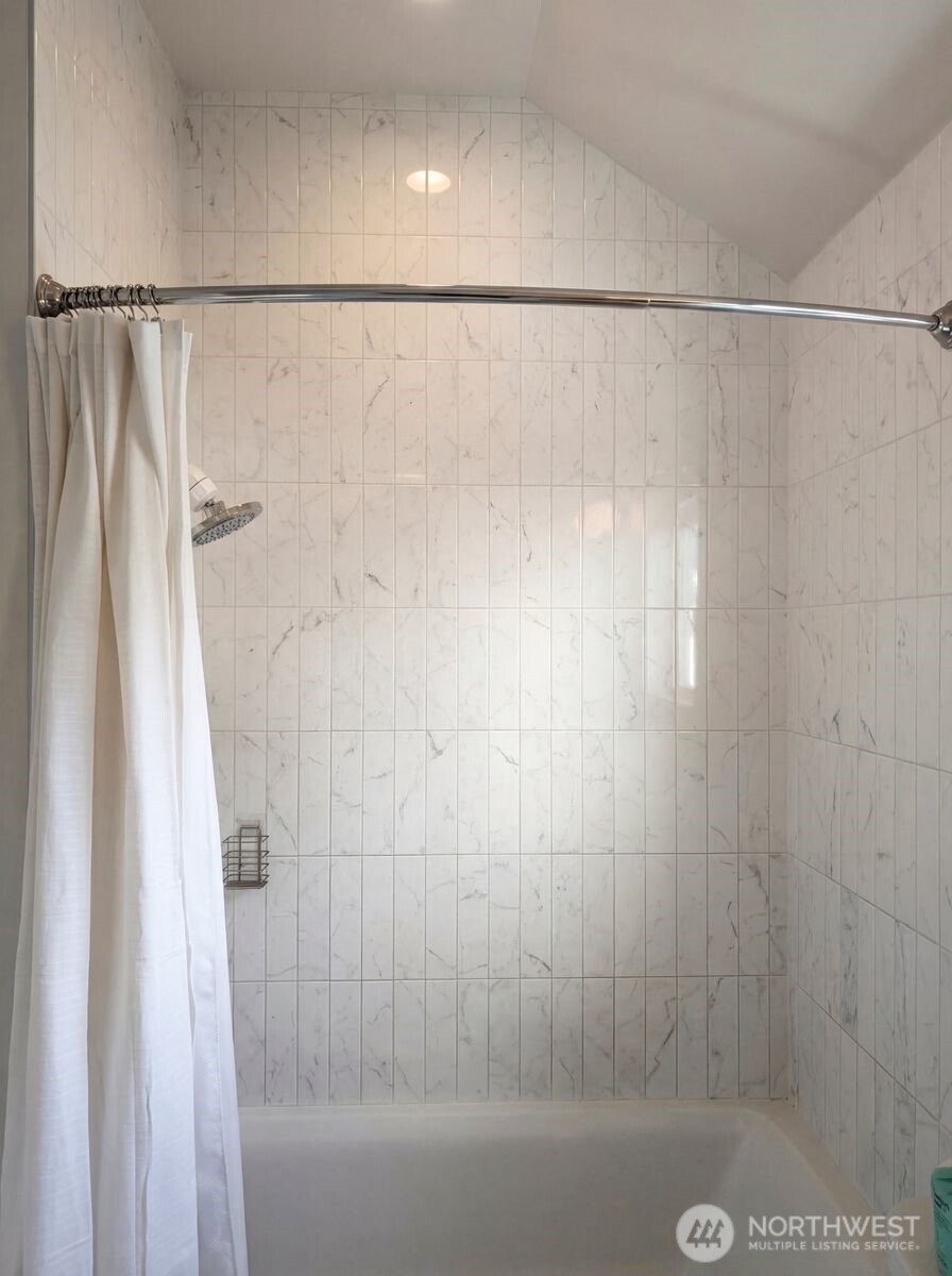 2211 17th Avenue South Seattle, WA 98144 - Photo 21 of 25 a bathroom with a shower and a bath tub