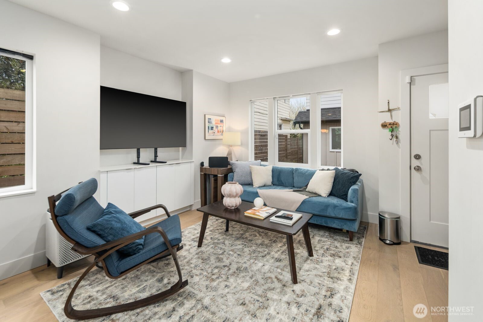 2211 17th Avenue South Seattle, WA 98144 - Photo 4 of 25 a living room with furniture a rug and a flat screen tv