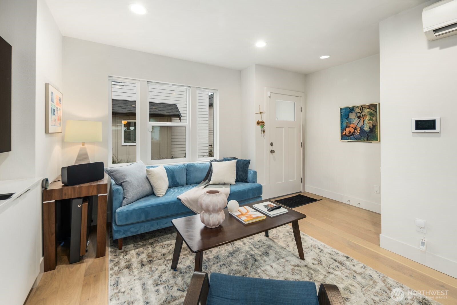 2211 17th Avenue South Seattle, WA 98144 - Photo 6 of 25 a living room with furniture rug and wall painting