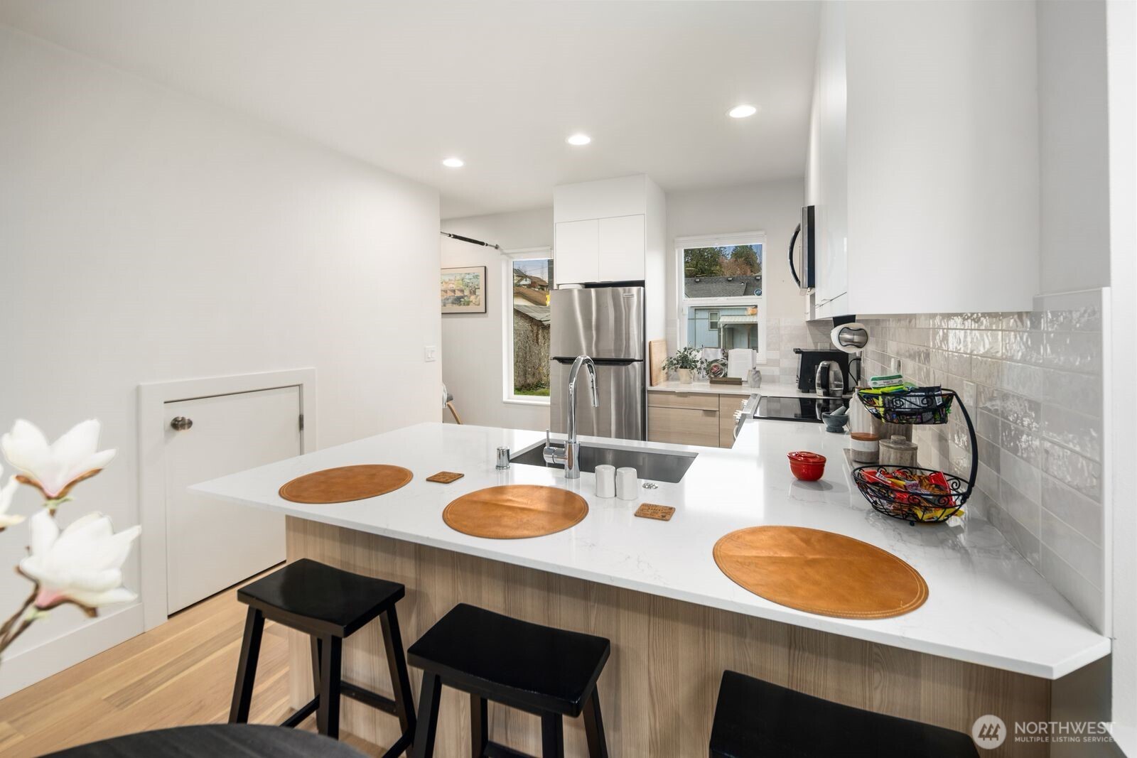 2211 17th Avenue South Seattle, WA 98144 - Photo 10 of 25 a dining room with furniture and a wooden floor