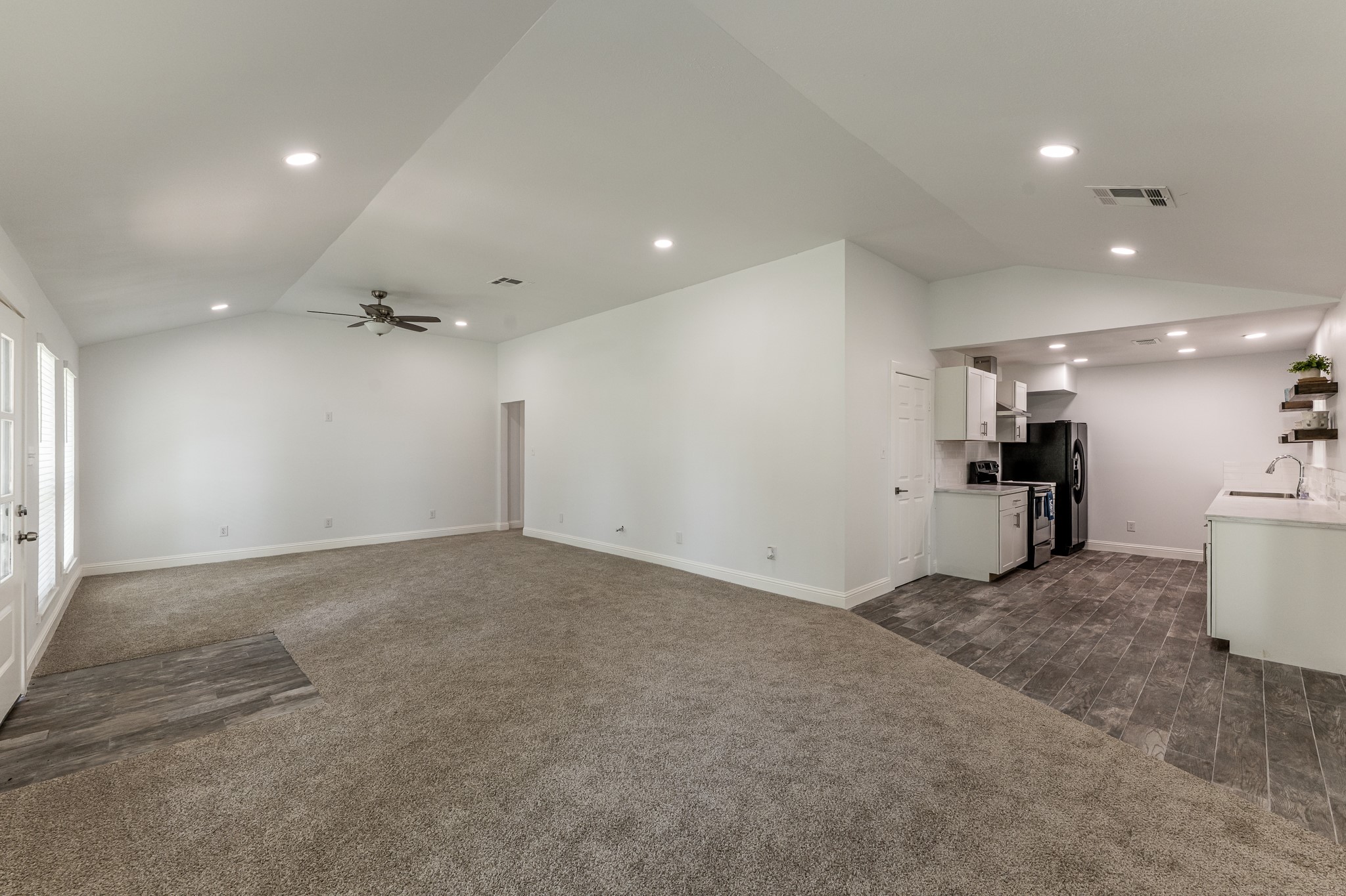 161 North Lakeway Circle Trinity, TX 75862 - Photo 12 of 25 an empty room with wooden floor and windows