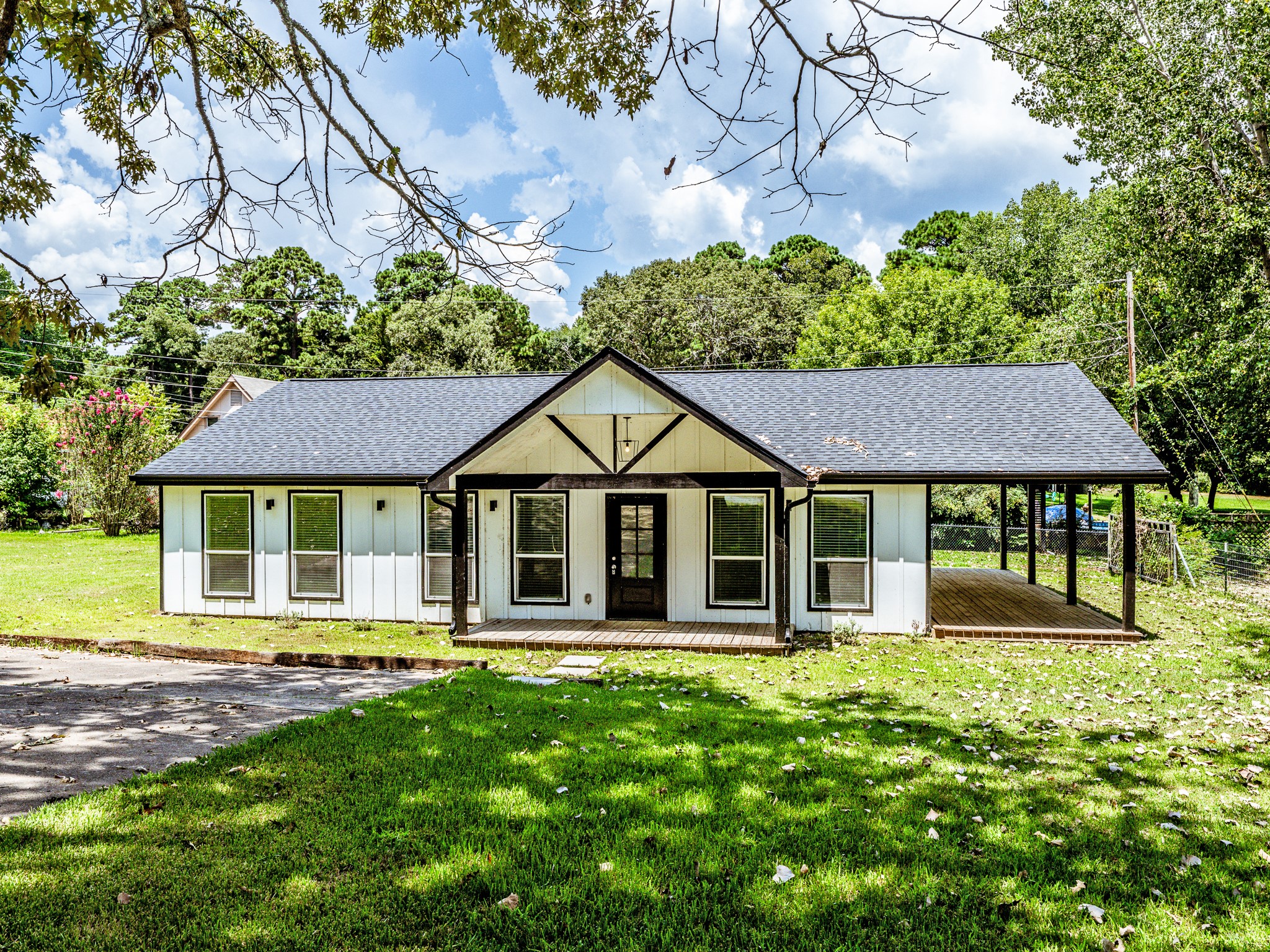 161 North Lakeway Circle Trinity, TX 75862 - Photo 3 of 25 a view of a house with a yard and plants