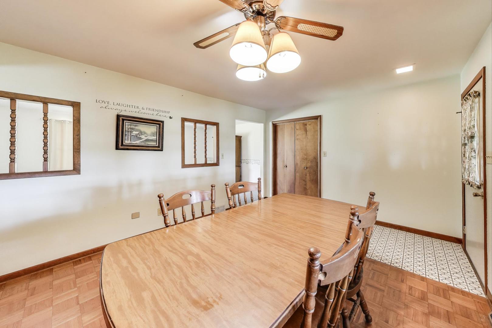7008 West Kennedy Road Peotone, IL 60468 - Photo 12 of 41 a bedroom with a bed and a chandelier