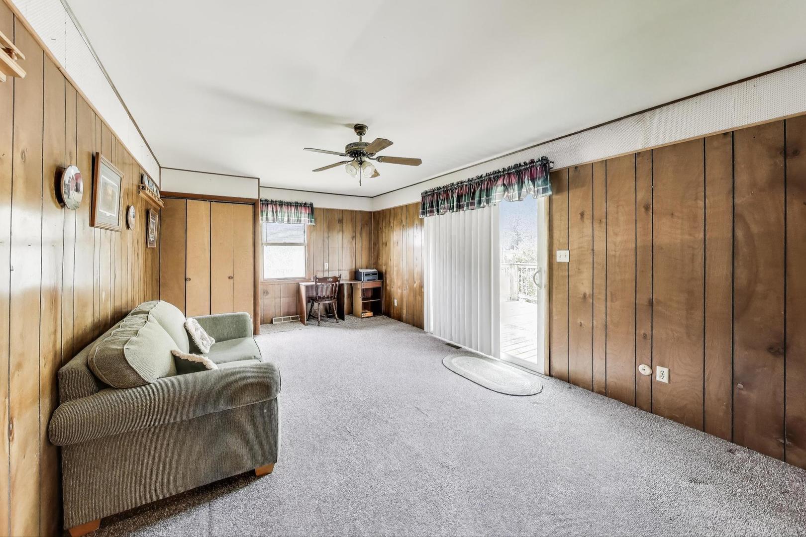 7008 West Kennedy Road Peotone, IL 60468 - Photo 16 of 41 a living room with furniture and a ceiling fan