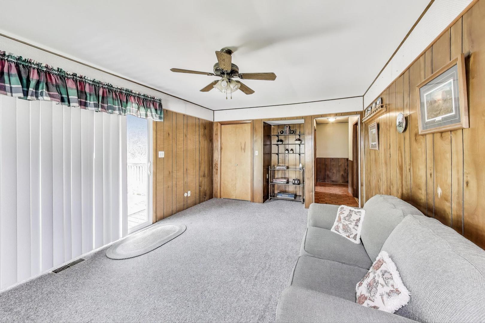 7008 West Kennedy Road Peotone, IL 60468 - Photo 18 of 41 a living room with furniture and a ceiling fan