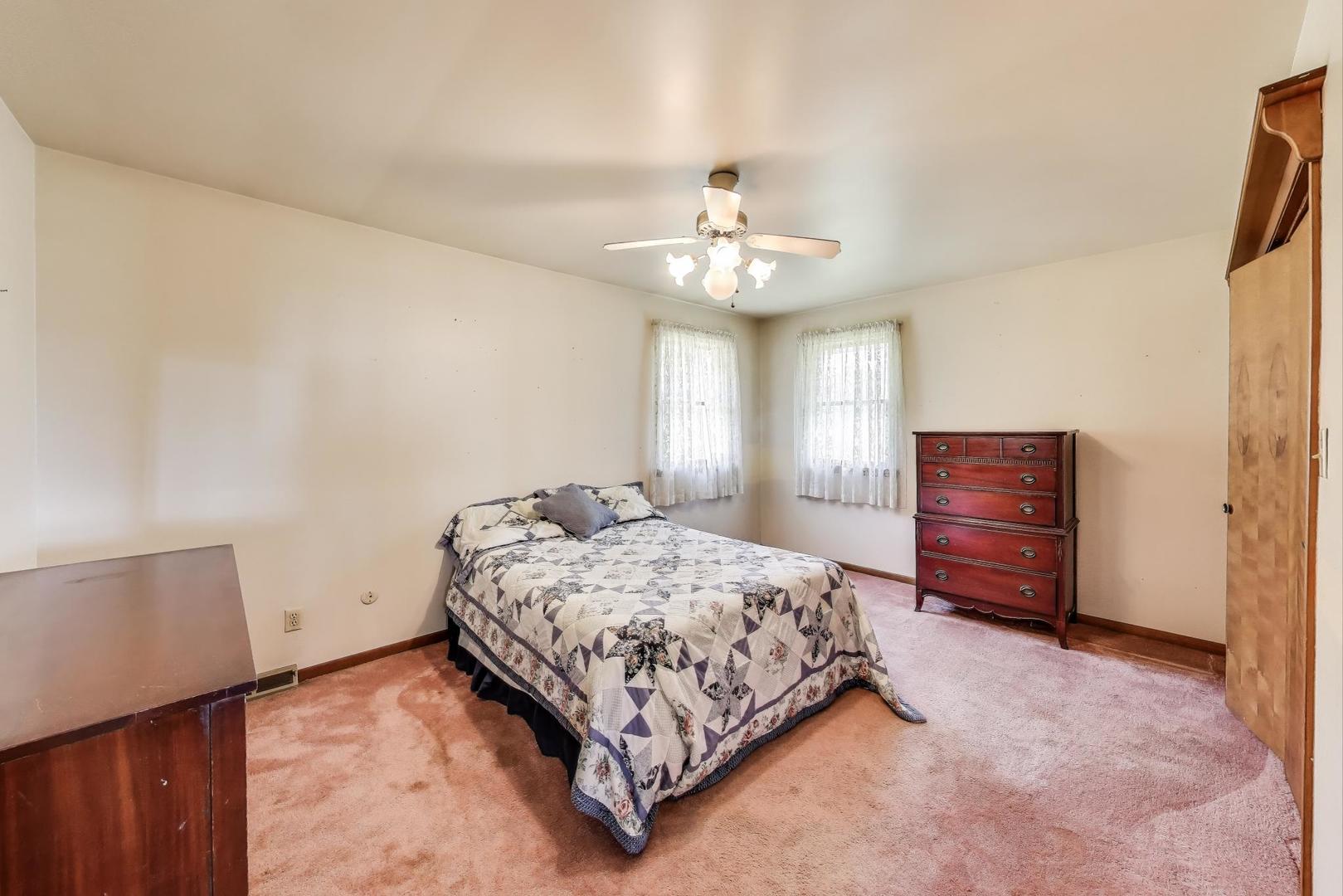 7008 West Kennedy Road Peotone, IL 60468 - Photo 25 of 41 a bedroom with a bed and dresser