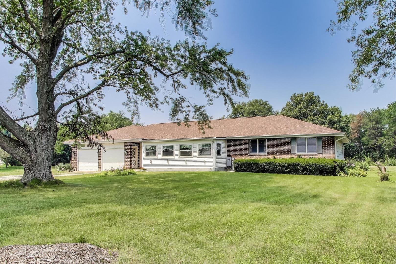 7008 West Kennedy Road Peotone, IL 60468 - Photo 3 of 41 a front view of a house with a garden