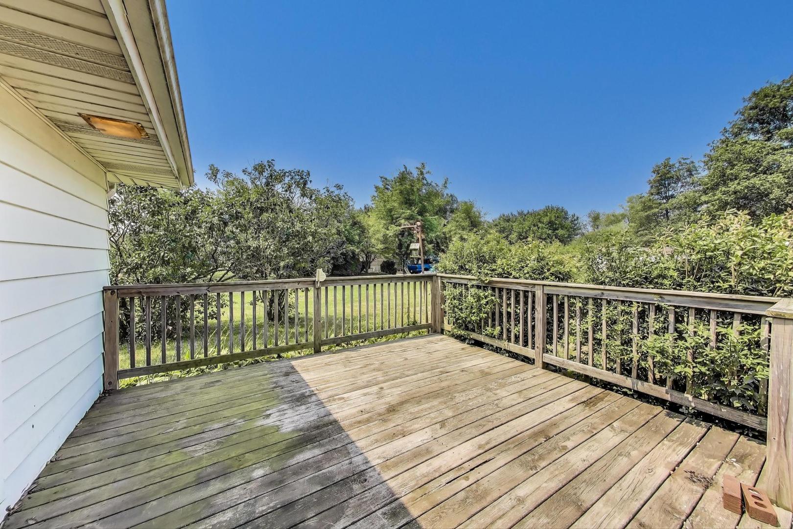 7008 West Kennedy Road Peotone, IL 60468 - Photo 31 of 41 a view of balcony with wooden floor and fence