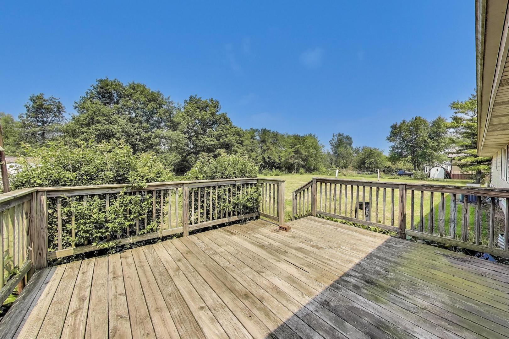 7008 West Kennedy Road Peotone, IL 60468 - Photo 32 of 41 a balcony with wooden floor and fence