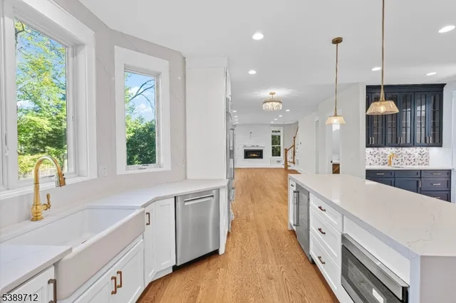 a view of an entryway with wooden floor and windows