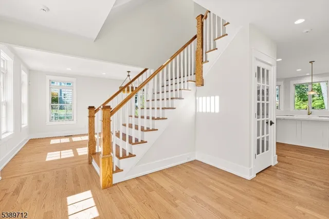 a view of an entryway with wooden floor