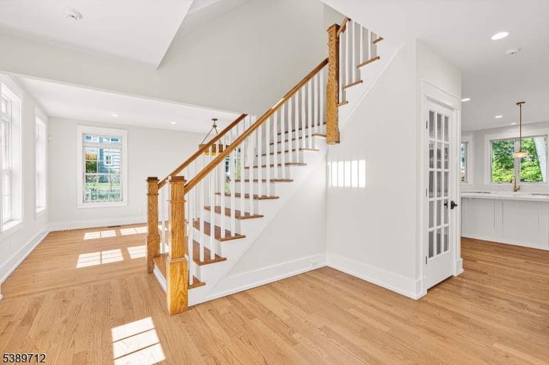 91 Woodland Road Madison, NJ 07940 - Photo 16 of 49 a view of an entryway with wooden floor and windows