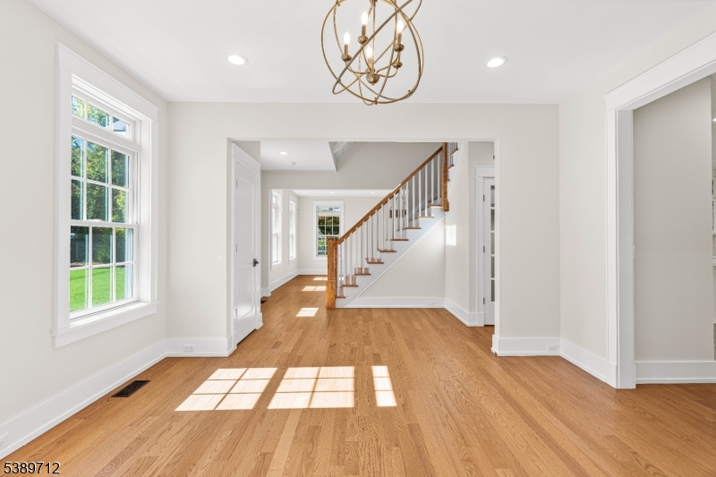 91 Woodland Road Madison, NJ 07940 - Photo 17 of 49 a view of an entryway with wooden floor