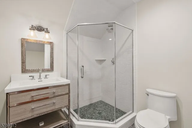 a spacious bathroom with a double vanity sink a mirror a bathtub and next to a window