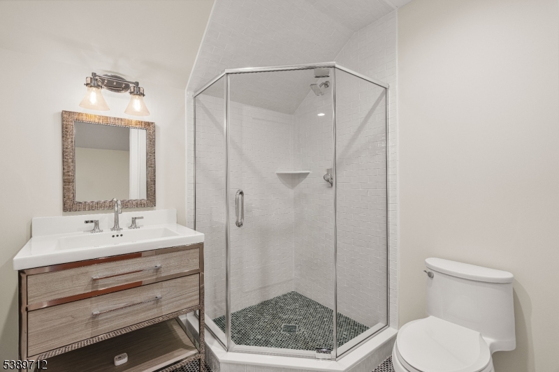 91 Woodland Road Madison, NJ 07940 - Photo 34 of 49 a bathroom with a toilet a sink and shower