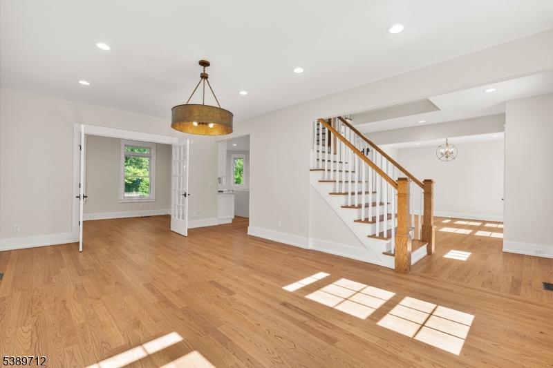 91 Woodland Road Madison, NJ 07940 - Photo 4 of 49 a view of entryway and hall with wooden floor