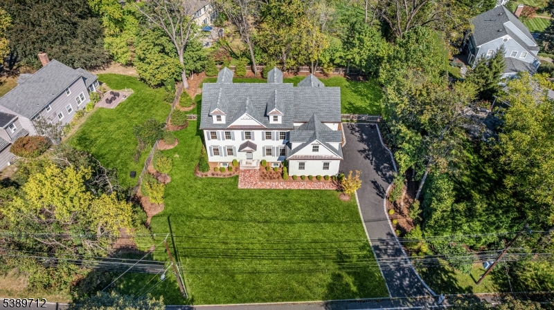 91 Woodland Road Madison, NJ 07940 - Photo 48 of 49 an aerial view of a house with yard swimming pool and outdoor seating
