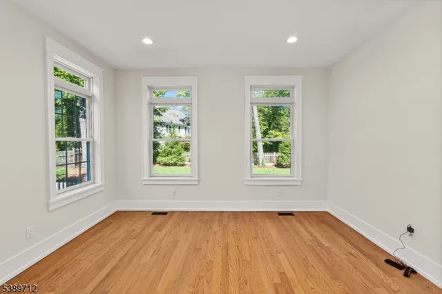 a view of kitchen with furniture and wooden floor