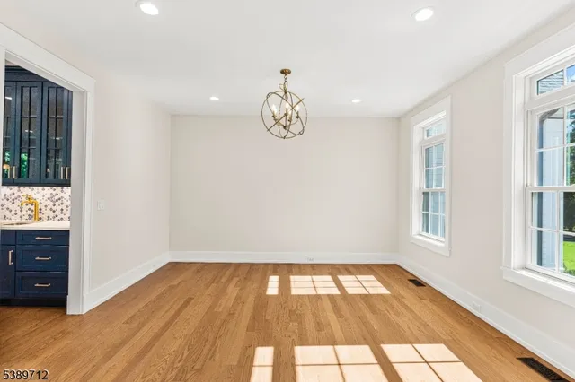 a kitchen with granite countertop sink and window
