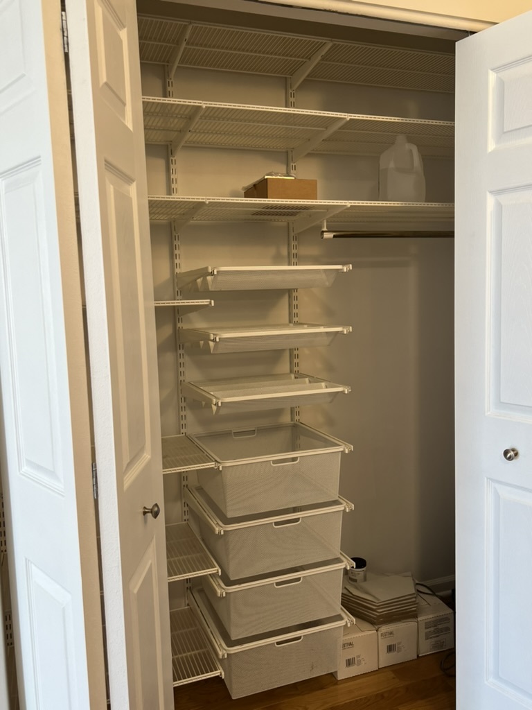 807 Davis Street, Unit 1308 Evanston, IL 60201 - Photo 7 of 16 a view of walk in closet with empty racks