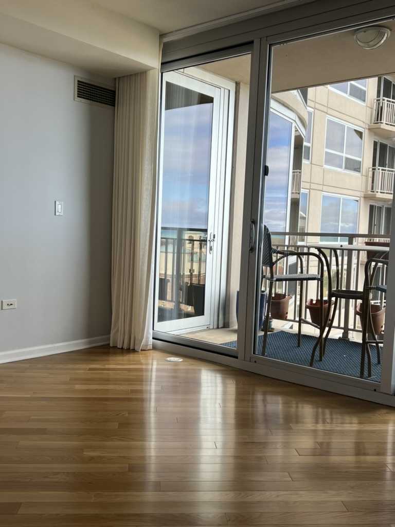 807 Davis Street, Unit 1308 Evanston, IL 60201 - Photo 9 of 16 a view of an entryway with wooden floor