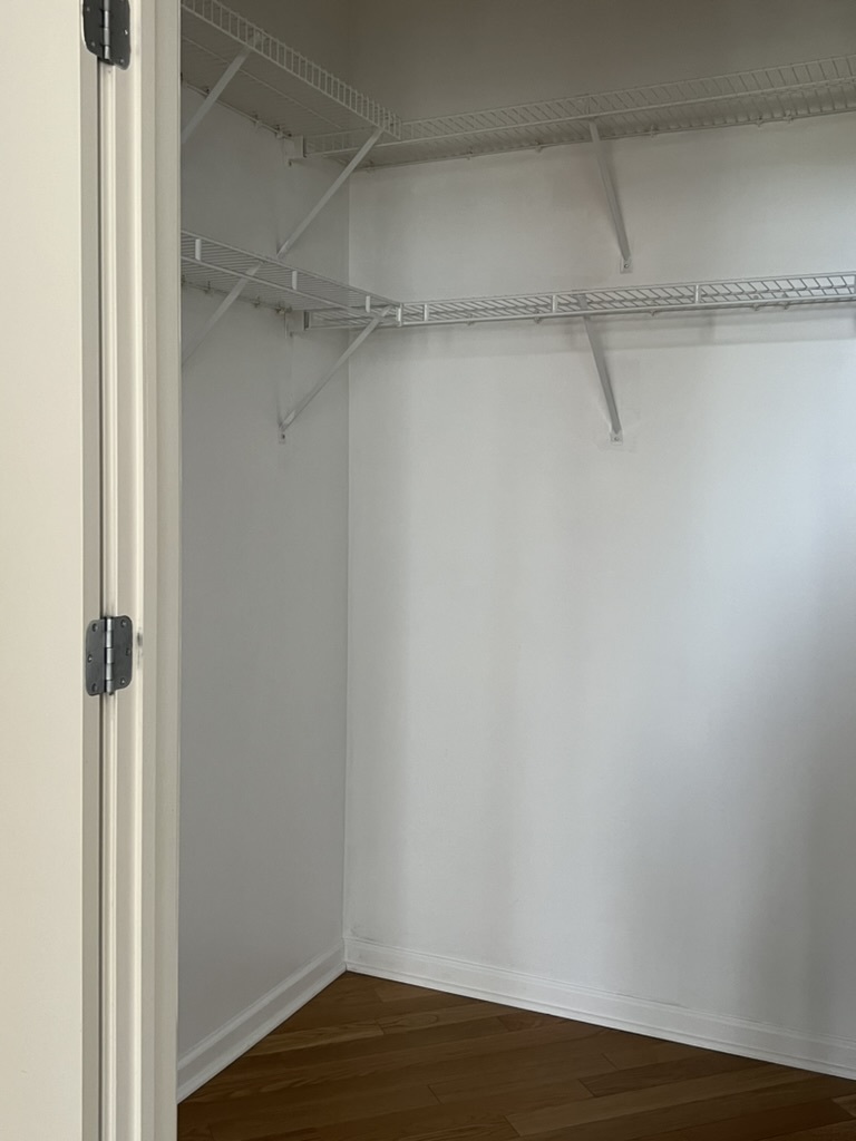 807 Davis Street, Unit 1308 Evanston, IL 60201 - Photo 10 of 16 a view of a room with racks on the wall