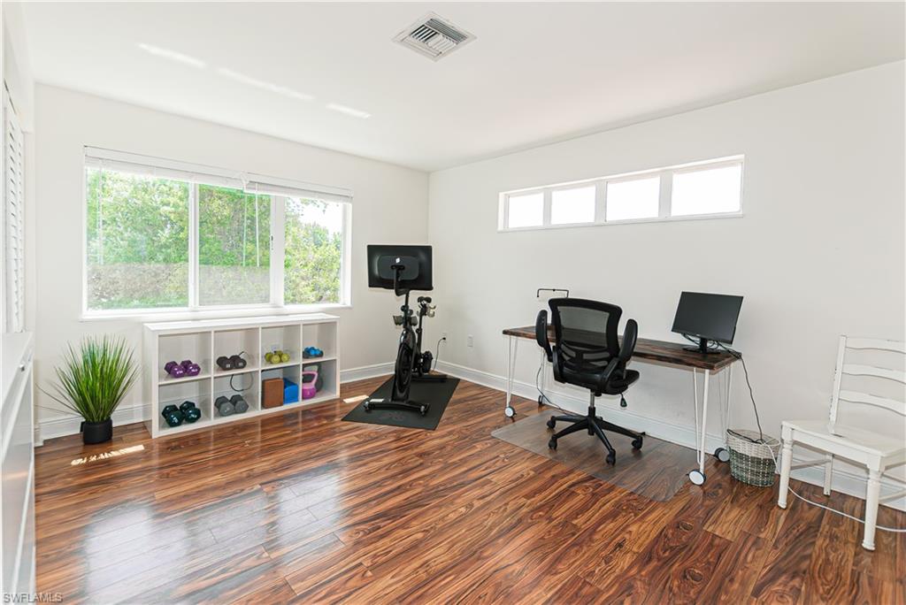 1060 Cooper Drive Naples, FL 34103 - Photo 13 of 24 Office featuring wood finished floors and baseboards
