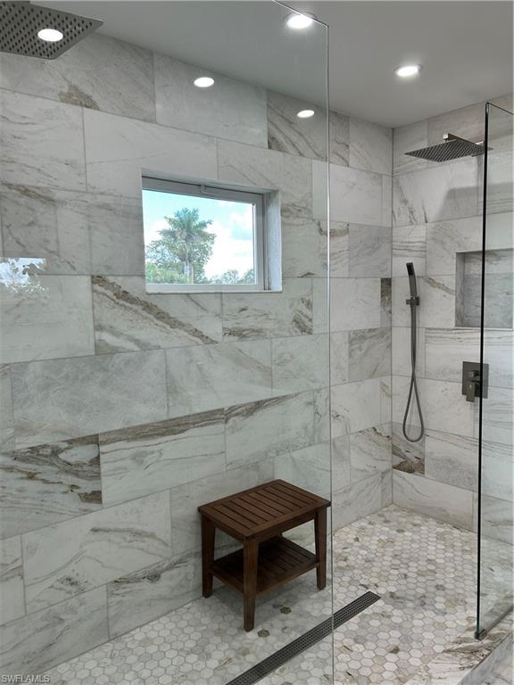 1060 Cooper Drive Naples, FL 34103 - Photo 19 of 24 Bathroom with a marble finish shower