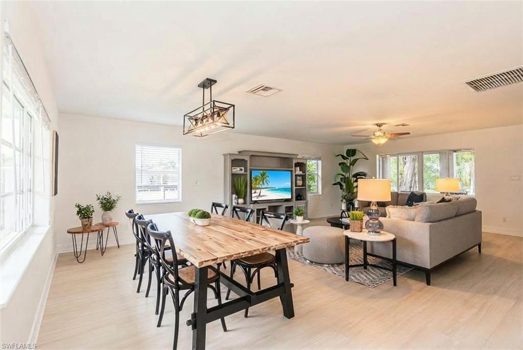 1060 Cooper Drive Naples, FL 34103 - Photo 6 of 24 Dining area featuring light wood-type flooring, healthy amount of natural light, and a ceiling fan
