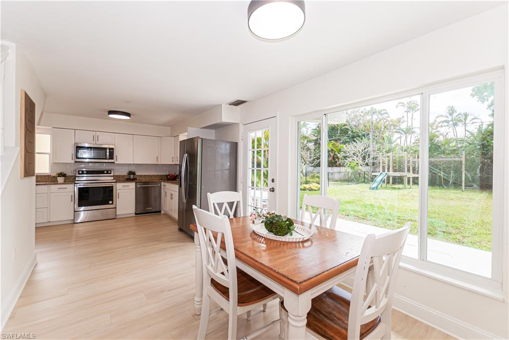 1060 Cooper Drive Naples, FL 34103 - Photo 8 of 24 Dining space featuring light wood finished floors and baseboards