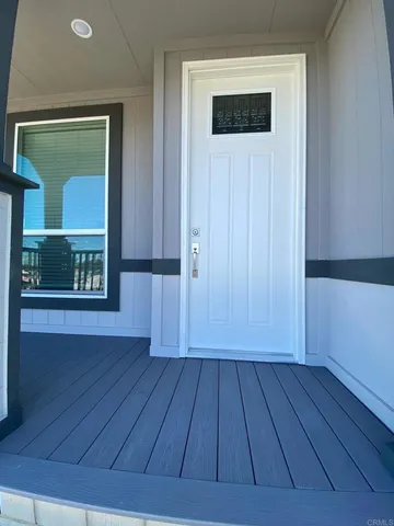 a view of backyard with wooden floor and cabinet