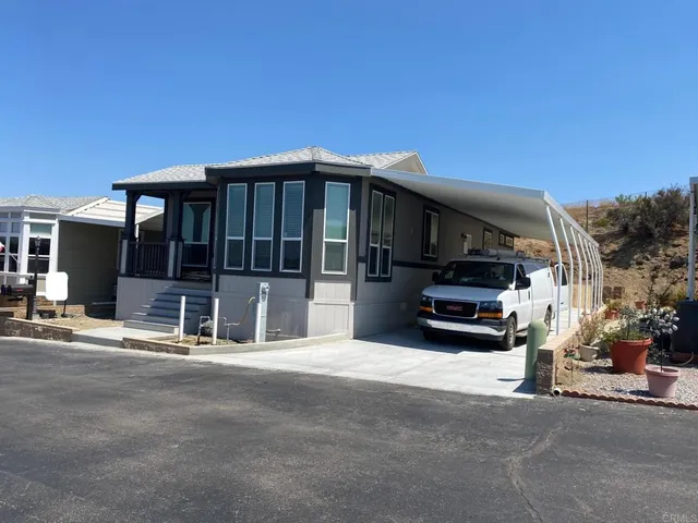 a view of a car park in front of house